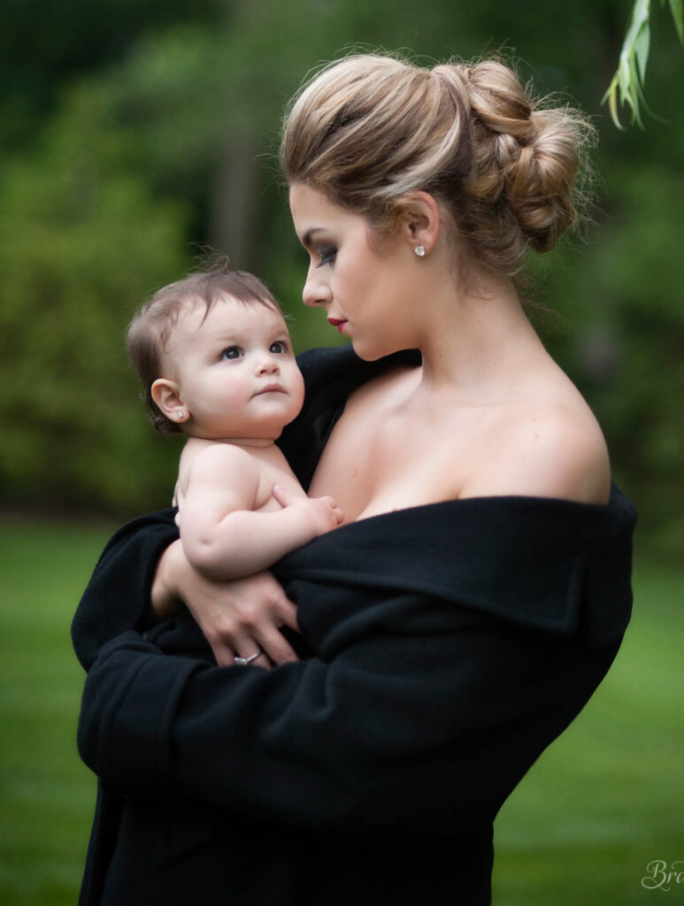 Mother holding her baby during an outdoor portrait session